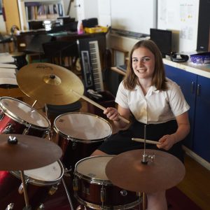 Girl Playing The Drums